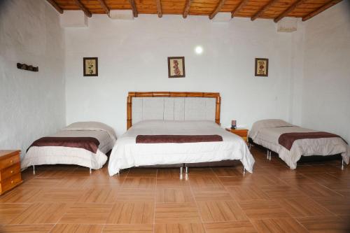 Ένα ή περισσότερα κρεβάτια σε δωμάτιο στο Hotel Campestre Inaoska Ecospa