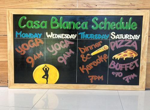 a chalkboard with a sign that says casa blanca schedule at Casa Blanca - San Pedro in San Pedro La Laguna
