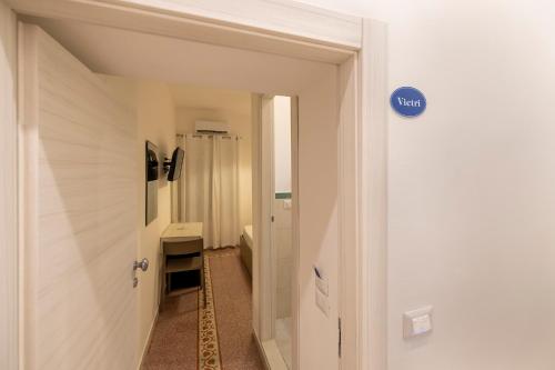 a bathroom with a sink and a toilet in a room at Villa Pino in Furore