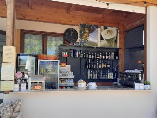 a counter in a store with a clock on the wall at Residence Parco del Sole in Rodi Garganico