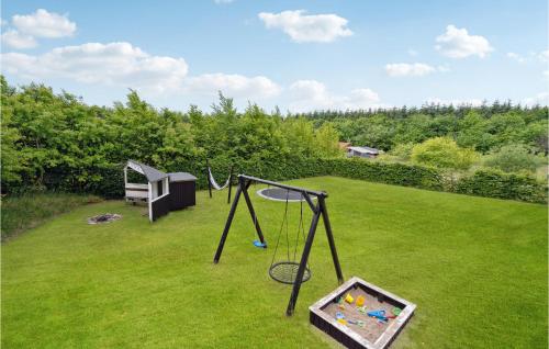 an aerial view of a yard with a swing set at Holiday Home Østmarken Toftlund Iv in Arrild