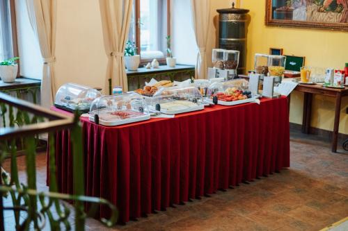 a red table with food on top of it at Penzion Bene in Chotěboř