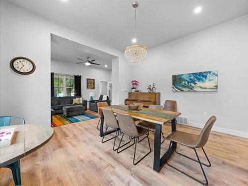 a dining room and living room with a table and chairs at 5 Bedroom - Located in Old Town Eagle in Eagle