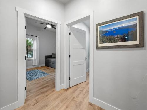 an empty room with a door and a picture on the wall at 5 Bedroom - Located in Old Town Eagle in Eagle