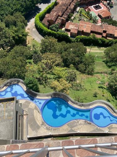 an overhead view of a swimming pool in a resort at Calazania in Limoncito