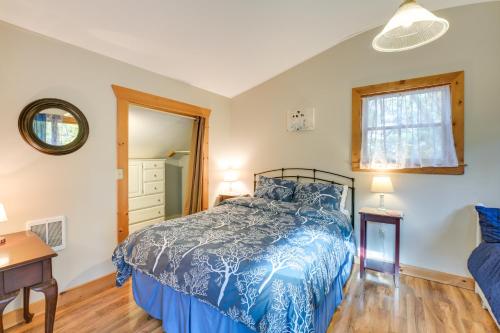 a bedroom with a bed and a desk and a window at 1 Mi to Acadia Home Near Downtown Bar Harbor! in Bar Harbor