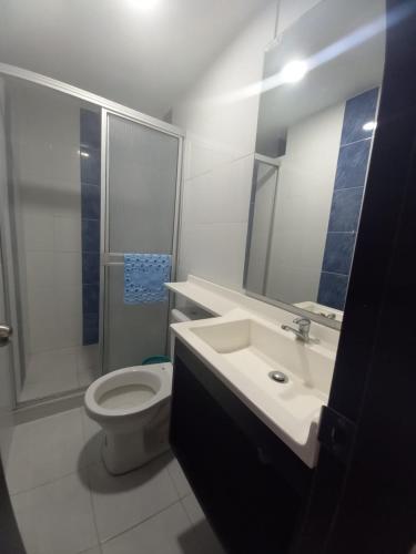 a bathroom with a sink and a toilet and a shower at Apartaestudios amoblados el caney in Cali
