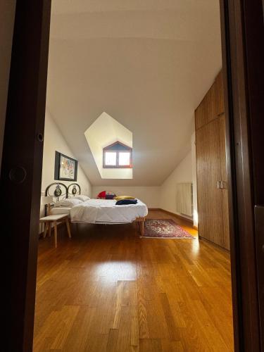 a bedroom with a bed in an attic at Le camere del Sal8 al Parco in Villasanta