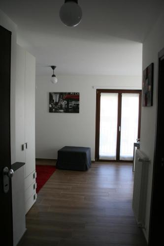 a living room with a bed and a door at Appartamento Morena CIR 0043 in Aosta