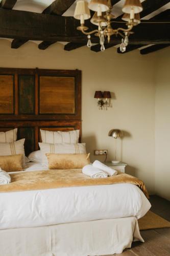 a bedroom with two large beds in a room at Mas el Mir in Ripoll