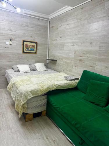 a bedroom with a bed and a couch at Happy House in Chişinău