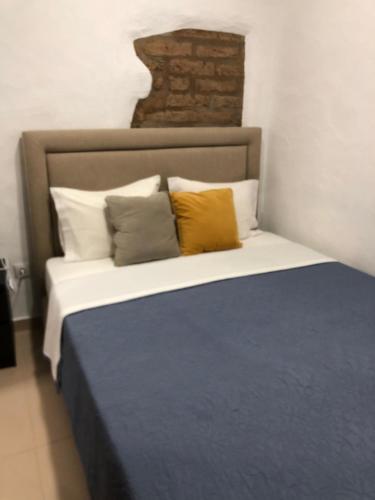 a bedroom with a bed with two pillows on it at Recanto da Aldeia in Monsaraz