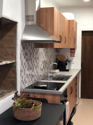 a kitchen with a sink and a counter top at Recanto da Aldeia in Monsaraz