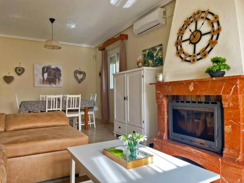 a living room with a couch and a fireplace at Casa Los Henke - Ole Solutions in El Puerto de Santa María