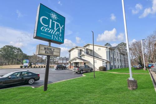 a sign for a city center inn in a parking lot at City Centre Inn at Newport News in Newport News