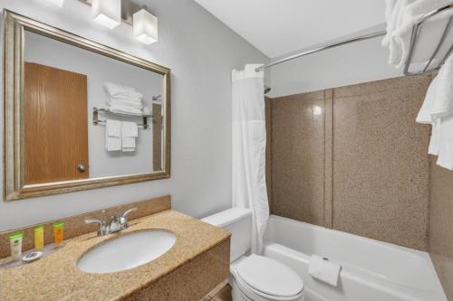 a bathroom with a sink and a toilet at City Centre Inn at Newport News in Newport News