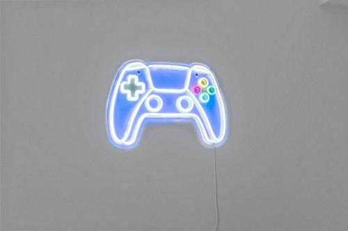 a video game controller sign on a table at Celestial Cottage with HotTub, Cold Plunge,Games in Dwight