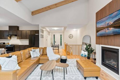 a living room with a couch and a fireplace at Celestial Cottage with HotTub, Cold Plunge,Games in Dwight