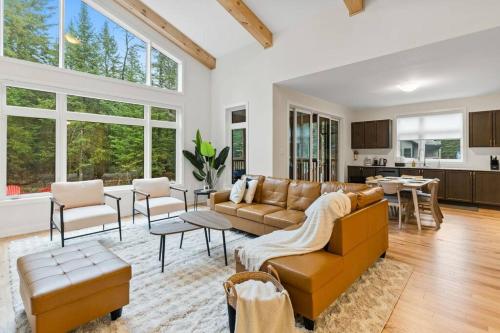 a living room with a couch and a table at Celestial Cottage with HotTub, Cold Plunge,Games in Dwight