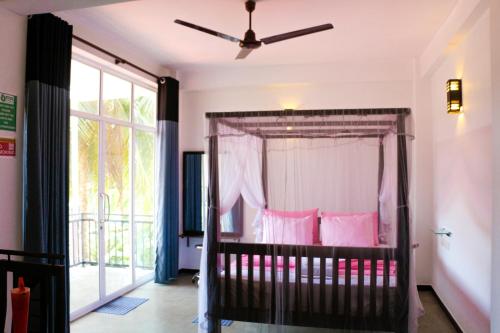 Cama o camas de una habitación en Unawatuna Guest