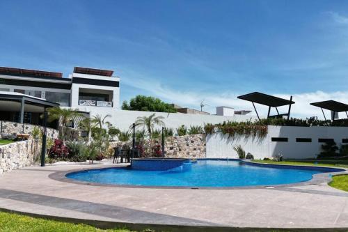 Kolam renang di atau dekat dengan Home resort departamento exclusivo y céntrico