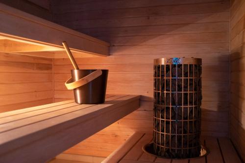 a sauna with a trash can in the middle at Rooslepa seaside getaway in Rooslepa