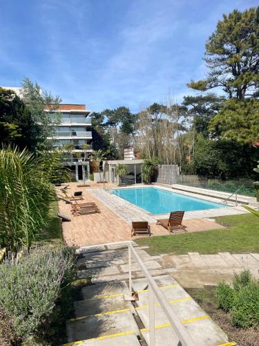 Piscina a Edificio Mansa Inn - Parada 17 Mansa o a prop