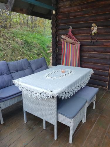 a table and two chairs on a patio at Zakątek u Basi in Twierdza