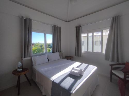 Katil atau katil-katil dalam bilik di Village dos Ipês Piscinas Naturais