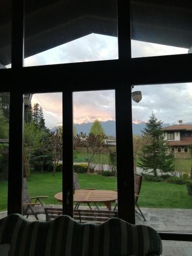 a view from a window of a patio with a table at Kameno in Banya