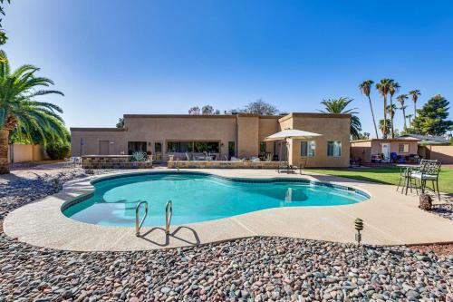 a swimming pool in front of a house at Pool Access! Scottsdale Biohack Healthy Dream Home in Phoenix