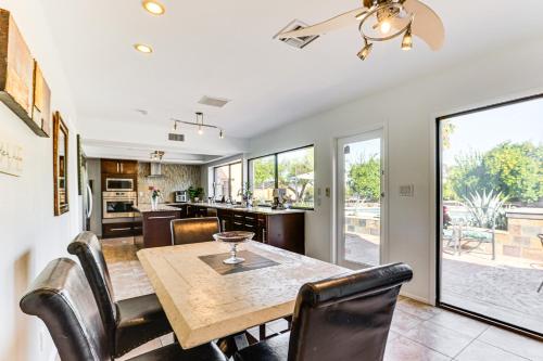 a kitchen and dining room with a table and chairs at Pool Access! Scottsdale Biohack Healthy Dream Home in Phoenix