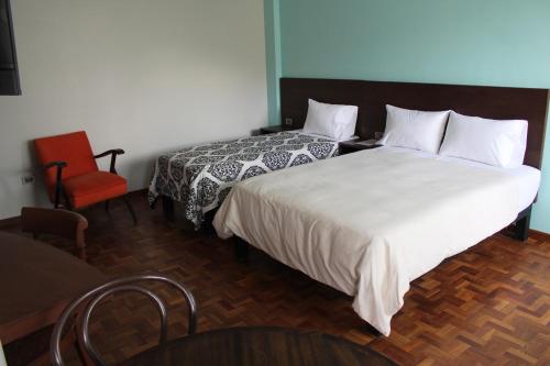 Postel nebo postele na pokoji v ubytování Kunan Hotel