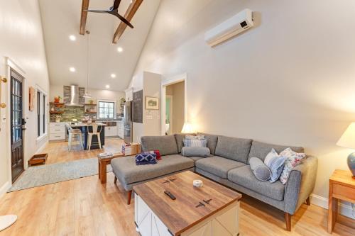 a living room with a couch and a table at Thistle Pond Cottage in Biddeford
