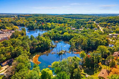 an aerial view of a river in a town at Antiquing and Fishing Riverfront Waupaca Home! in Waupaca