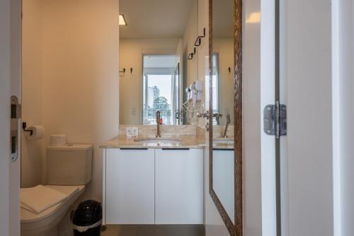 a bathroom with a sink and a toilet at 360 Nações Unidas in Sao Paulo