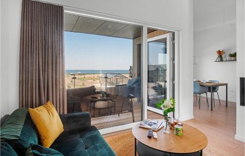 a living room with a couch and a table at Havnehusene, Lejl 40 in Slagelse