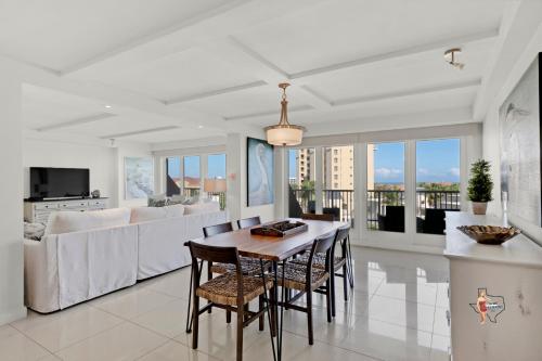 a kitchen and living room with a table and chairs at Bahia Mar-Solare Tower, Beachfront Resort with Two Pools in South Padre Island