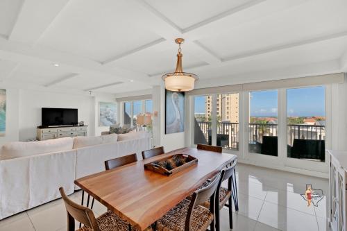 a living room with a table and a couch at Bahia Mar-Solare Tower, Beachfront Resort with Two Pools in South Padre Island