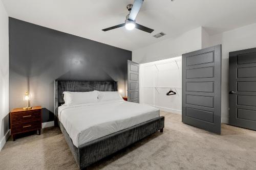 a bedroom with a large bed and a closet at The Nomad ATL in Atlanta