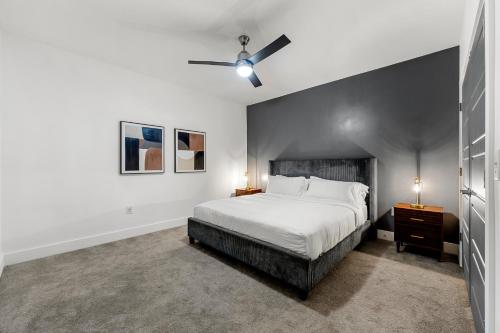 a bedroom with a bed and a ceiling fan at The Nomad ATL in Atlanta