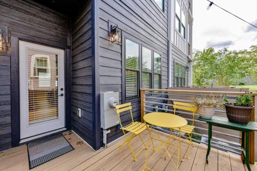 a patio with a table and chairs on a deck at On the Move in Plaza Midwood in Charlotte