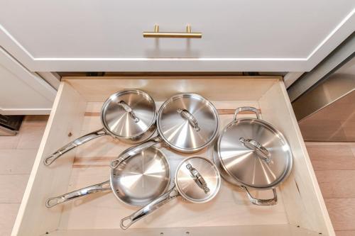 a group of silver utensils in a wooden box at On the Move in Plaza Midwood in Charlotte