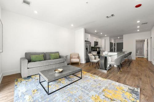 a living room with a couch and a table at The Nomad ATL in Atlanta