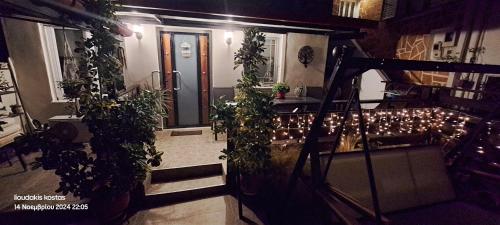 a staircase with plants and lights in a building at Zoe garden home in Spáta