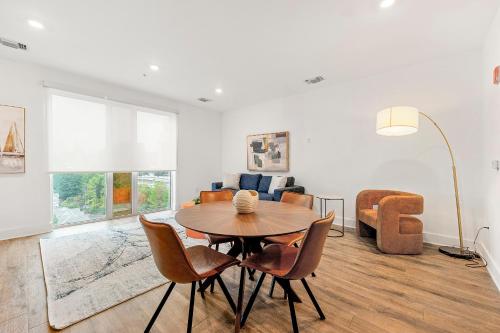 a living room with a table and chairs and a couch at The Nomad ATL in Atlanta