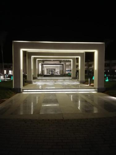 a large building with lights on it at night at Chalet NEMO, vista mare, Sharks Bay, Sharm el Sheikh in Sharm El Sheikh