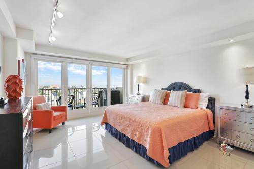 a bedroom with a bed and a balcony at Bahia Mar-Solare Tower, Beachfront Resort with Two Pools in South Padre Island