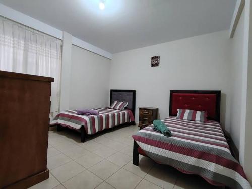 Cama o camas de una habitación en Villa Serenidad