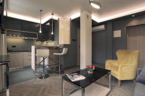 a living room with a couch and a table at Apartamenty Zamenhofa in Białystok